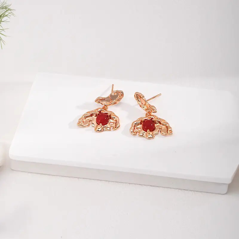 Flat lay of agate butterfly earrings – slow fashion jewellery by Anais & Aimee