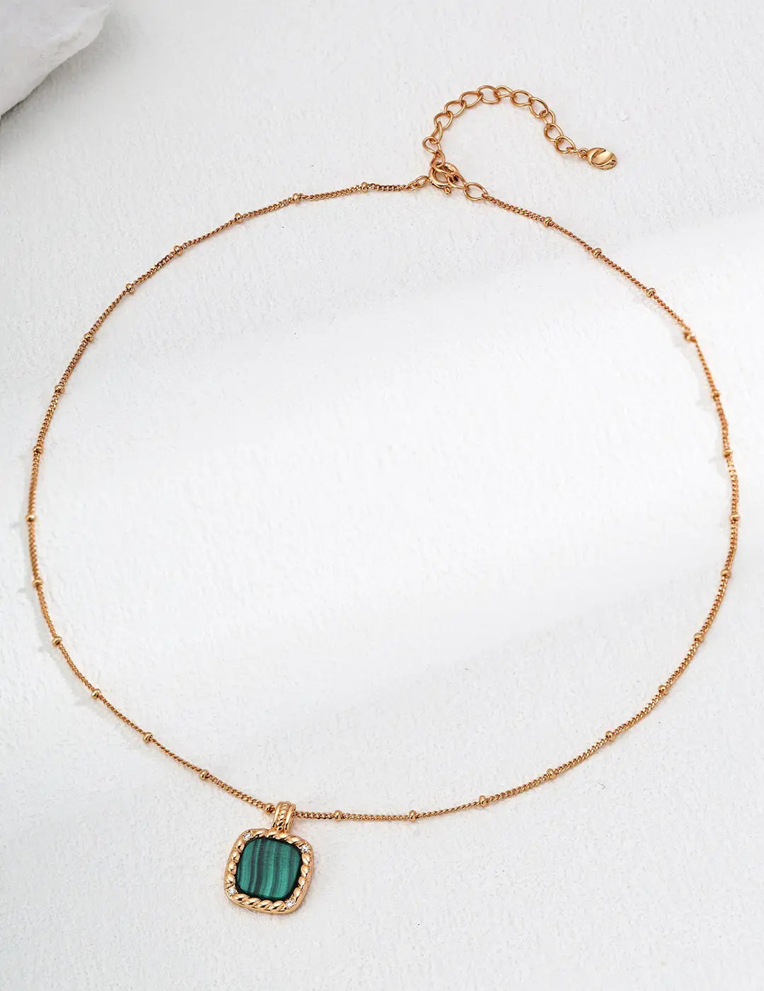 Vintage gold malachite pendant necklace with green gemstone by Anaïs & Aimee.