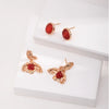 Aimee Gold Agate Drop Earrings displayed with an additional pair of red stone stud earrings, emphasizing the versatile and luxurious design perfect for various styles.