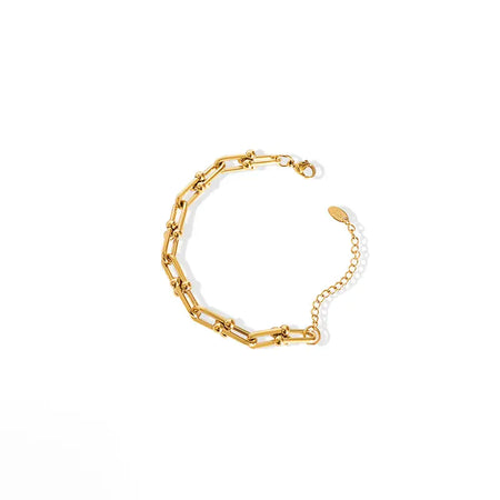 A close-up photo of a gold link bracelet on a white background.