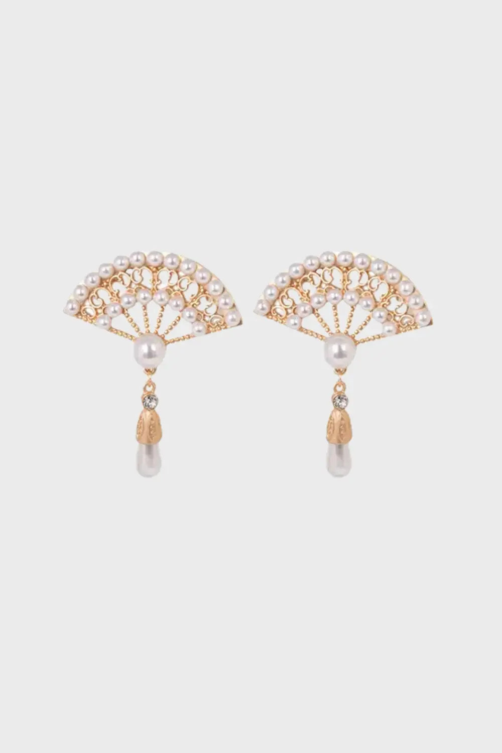 Elegant hand-fan shaped drop earrings with freshwater pearls, gold details, and gemstone