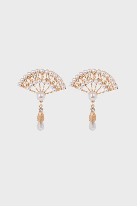 A pair of elegant drop earrings designed in a delicate hand-fan shape, adorned with freshwater pearls and intricate gold detailing. Each earring features a dangling pearl drop and a small sparkling gemstone, perfect for adding a touch of sophistication and grace.