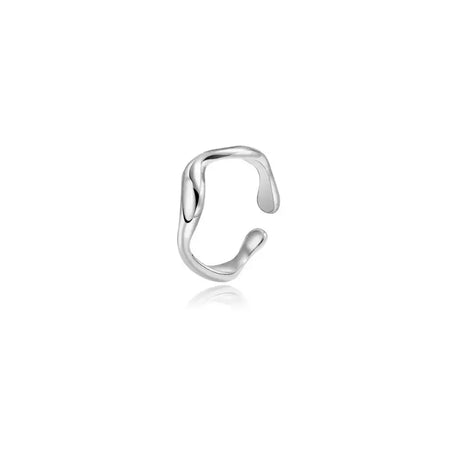 Sleek sculptural silver cuff ring with a fluid, open-ended design, showcasing a modern and minimalist aesthetic.