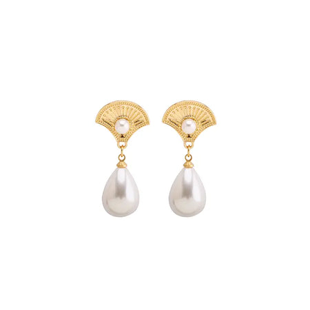 The image shows a pair of gold earrings. Each earring features a fan-shaped top, intricately designed with delicate filigree patterns and a small pearl at the center. From this fan descends a large, smooth pearl drop, giving the earrings an elegant and sophisticated appearance. The overall design combines classic elements with a touch of modern flair, suitable for both formal and casual occasions.