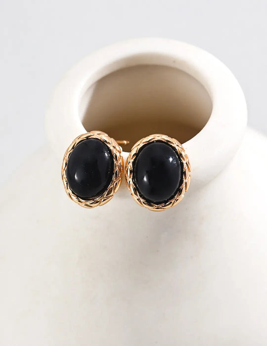 Anais & Aimee Black Obsidian earrings in gold-plated finish, showcasing a luxurious and stylish touch for any outfit.