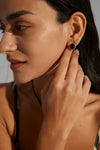 Anais & Aimee modern Black Obsidian earrings showcased on a model's side profile, exuding timeless elegance and contemporary style.