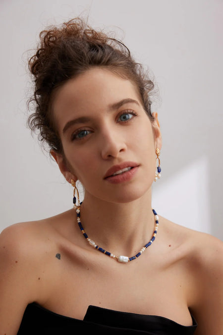 Model wearing the Navy Blue Lapis Lazuli Beads with Baroque Pearls Choker by Anaïs & Aimee, styled with a classic black outfit to showcase its timeless elegance.