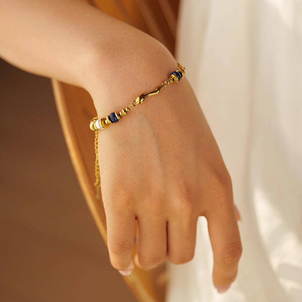 Elegant gold and lapis lazuli jewellery bracelet featuring lapis lazuli stones, photographed for lapis lazuli jewellery UK collections