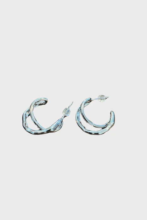 Anaïs & Aimee's sleek C-Cross Sterling Silver Earrings displayed against a clean background, showcasing their minimalist yet artistic design.