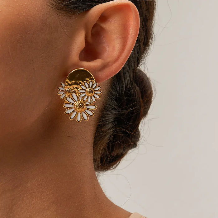 Side profile of a model wearing the Aimee Floral Statement Gold Earrings, exuding effortless sophistication with their lightweight floral design and luminous 18K gold-plated brass finish—an exquisite blend of nature and modern minimalism.