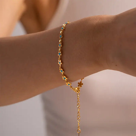 Dainty Blue Flower Bracelet - Delicate Gold Chain with Blue Floral Charms, Perfect for Women and GirlsDainty Blue Flower Bracelet - Elegant Gold Chain with Blue Floral Charms, Worn by Model as Necklace and Bracelet Set, Ideal for Stylish Women and Girls