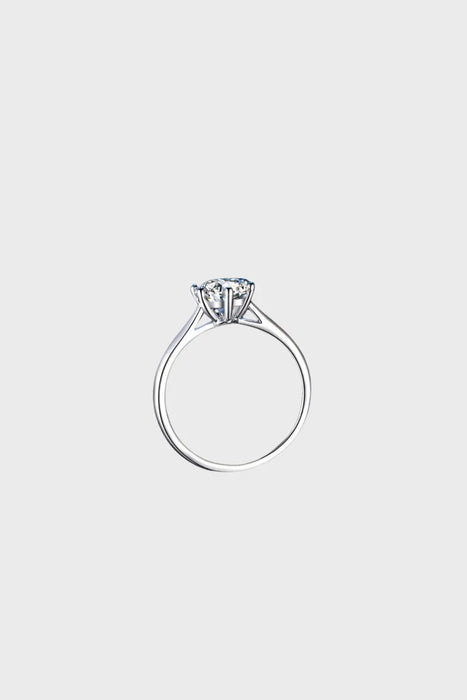 Profile view of the Elysian Moissanite Engagement Ring, showcasing the sleek claw setting that maximises light reflection for ultimate brilliance