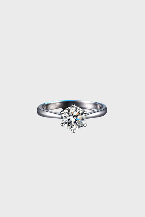 Top-down view of the Elysian Moissanite Ring, featuring a solitaire moissanite stone and sterling silver band. The perfect UK engagement ring under £100.