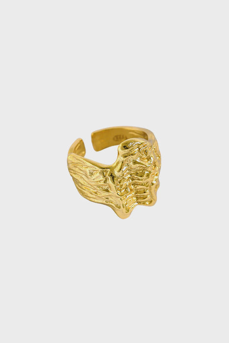 Organic, textured gold statement ring by Anaïs & Aimee, featuring an abstract, wavy design inspired by natural forms.