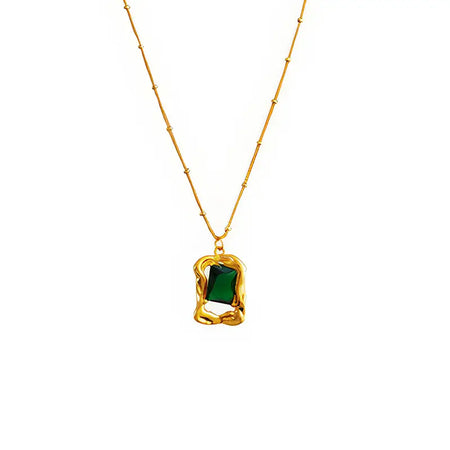 Elegant Evergreen Emerald Stud Necklace featuring a luxurious green crystal pendant on a delicate gold chain - Perfect for adding a touch of sophistication to any outfit.