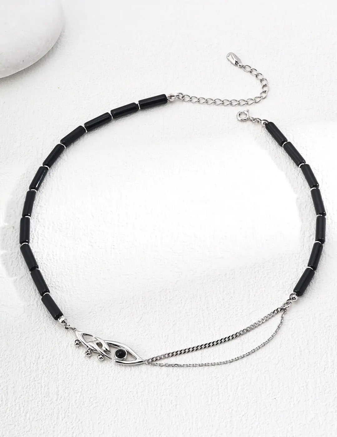 Full view of the Evil Eye Black Obsidian Necklace in silver, featuring sleek black obsidian beads and delicate silver chains for a timeless look. Keywords: Anais & Aimee, modern, Black Obsidian, silver necklace.









