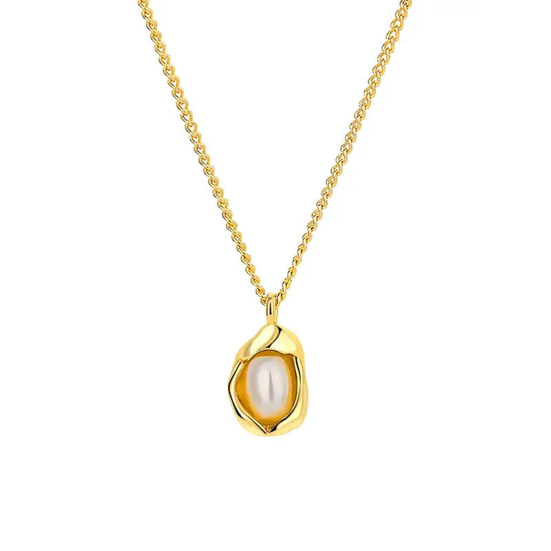Delicate gold pendant necklace with a freshwater pearl in a smooth oval setting