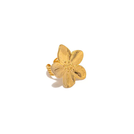 Gold ring featuring a detailed hibiscus flower design with polished petals, displayed against a white background.