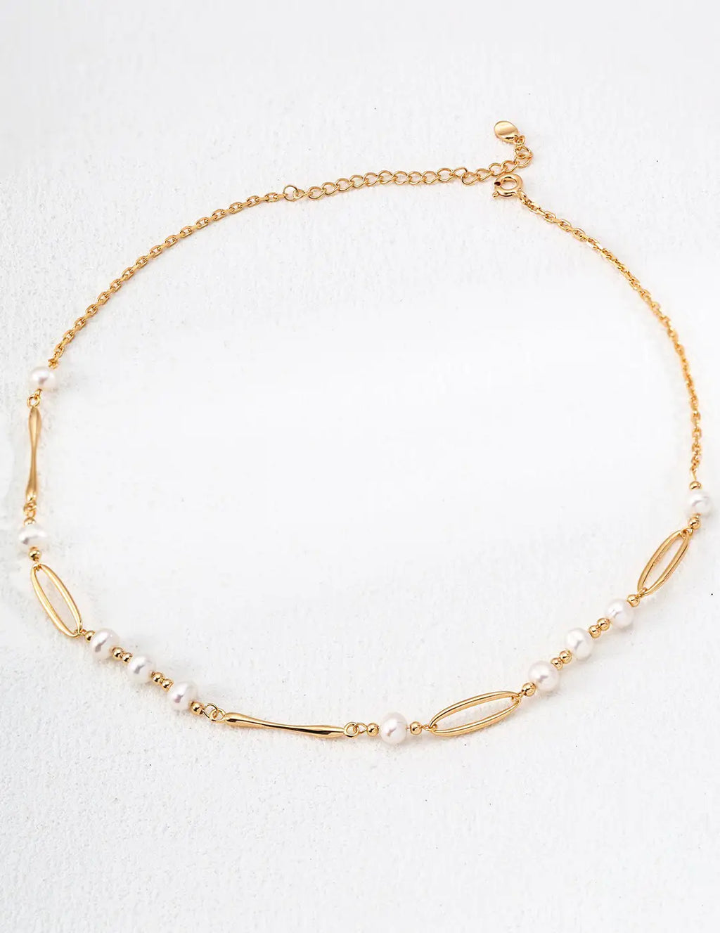Close-up of Kingsbury Freshwater Pearl Chain Necklace with freshwater pearls and gold accents.