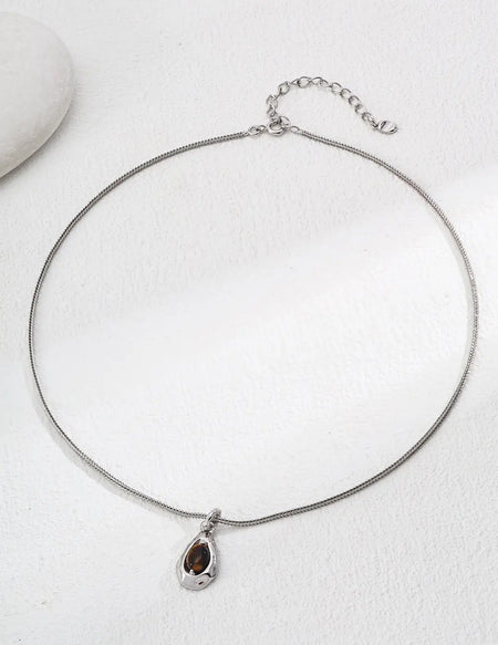 Anaïs & Aimee Lille Tiger's Eye Silver Necklace - A stunning jewelry piece featuring a Tiger's Eye gemstone, perfect for London’s fashion-forward women.