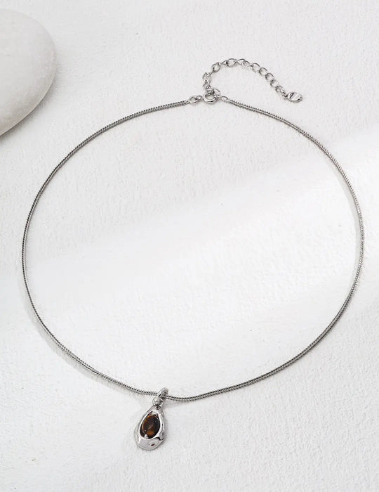 Anaïs & Aimee Lille Tiger's Eye Silver Necklace - A stunning jewelry piece featuring a Tiger's Eye gemstone, perfect for London’s fashion-forward women.