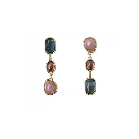 Luminous Crystal Strata Earrings featuring a trio of vibrant, multicolored gemstones in blue, pink, and red tones, set in elegant gold-tone frames. These high trending earrings are perfect for making a bold fashion statement and adding a touch of luxury to any ensemble.