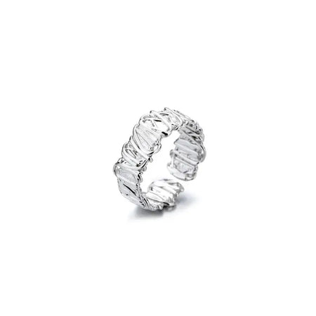 The image showcases a luxurious and intricately designed silver ring that features a unique spiral shape with a detailed, textured finish that gives it the appearance of multiple stacked rings. The reflective surface of the silver highlights the fine craftsmanship and artistry involved in its creation. This ring would stand out as a sophisticated accessory in any jewelry collection, reflecting both light and elegance.