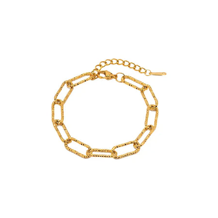 displays a paperclip chain bracelet crafted in gold. Each link resembles a small paperclip, contributing to a minimalist yet stylish design. The bracelet features a fine-textured finish on each link, enhancing its visual appeal. It includes an adjustable chain with a simple hook closure, allowing for a comfortable fit around the wrist. This accessory is elegant and versatile, suitable for both casual and formal occasions