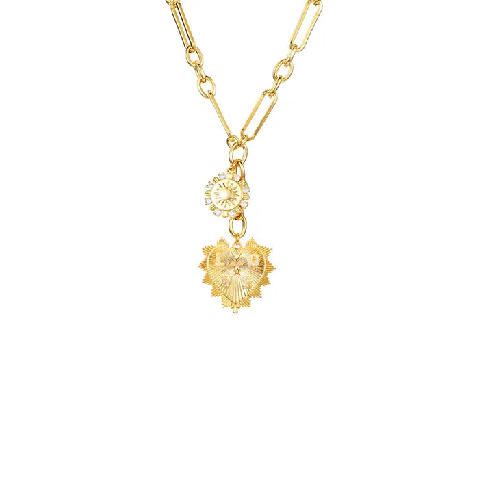 Radiant Sunburst Charm Necklace featuring a gold chain with intricate sunburst and heart-shaped charms. Elegant and stylish jewelry piece perfect for adding a touch of glamour to any outfit.