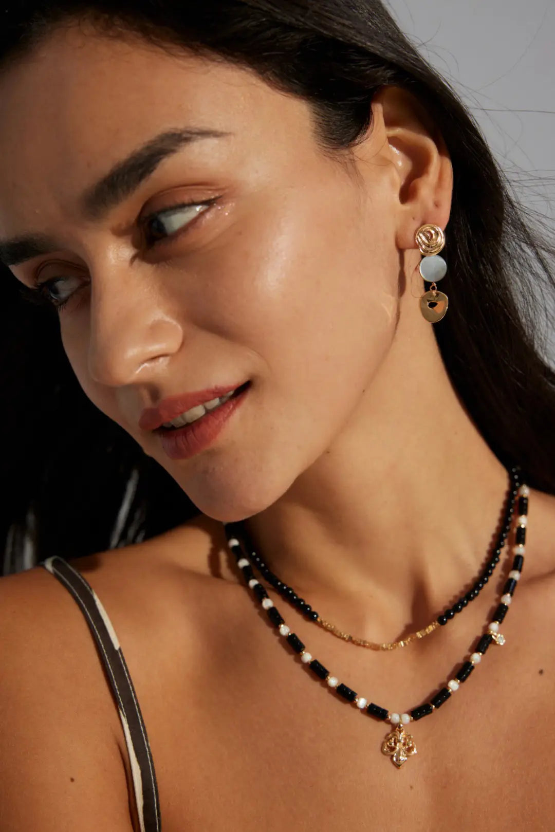 Anais & Aimee modern Royal Black Obsidian Pearl Necklace displayed in an elegant collection. A stunning blend of Black Obsidian beads and classic pearls.