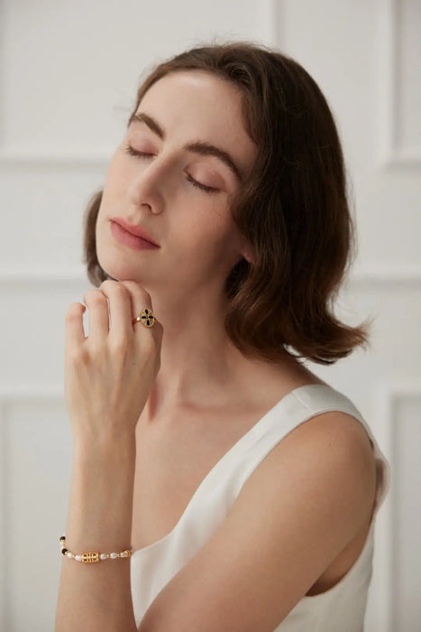 Elegant Royal Black Obsidian adjustable ring styled on a woman's hand.