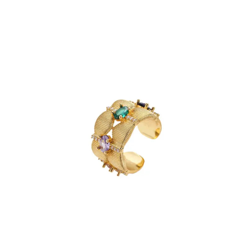 Tempestuous Hues Hoops featuring a bold gold-tone design with intricate texturing, adorned with vibrant multicolored gemstones. These high trending hoop earrings are perfect for making a luxurious and stylish fashion statement, ideal for elevating any look.