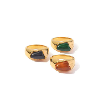 Tri-Color Gemstone Gold Signet Rings featuring a polished gold-tone band with vibrant gemstone accents in black, green, and amber hues. These high trending accessories add a touch of bold elegance and sophistication, perfect for making a stylish statement.