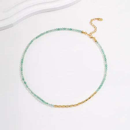 Verdant Green Quartz Necklace by Anais & Aimee, featuring delicate green quartz beads symbolizing growth and renewal, complemented by gold accents for a touch of elegance.