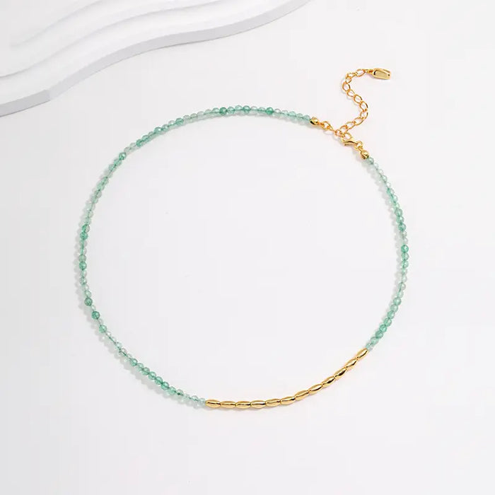 Verdant Green Quartz Necklace by Anais & Aimee, featuring delicate green quartz beads symbolizing growth and renewal, complemented by gold accents for a touch of elegance.