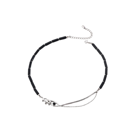 Elegant black and silver necklace featuring a sleek evil eye pendant with a black centerpiece, complemented by a delicate chain extension for adjustable length, set against a plain white background.