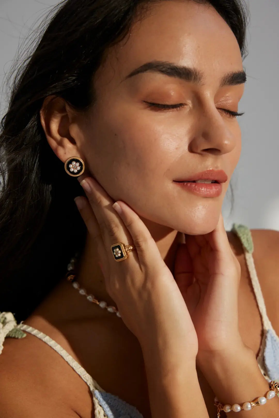 Handcrafted Vintage Grace Pearl & Enamel Earrings worn by a model, styled with a matching gold-plated pearl bracelet and enamel ring. Perfect for luxury vintage jewellery lovers in the UK. Available for nationwide delivery, including London, Manchester, and Edinburgh