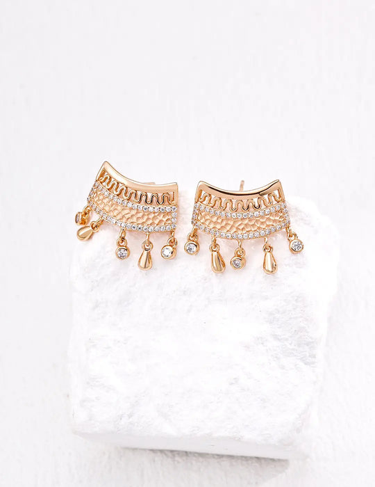 Close-up of Anaïs & Aimee vintage gold sterling silver earrings featuring intricate detailing and sparkling zirconia stones, ideal for elegant occasions.