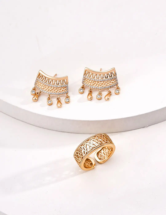 Anaïs & Aimee vintage gold sterling silver earrings paired with a matching intricately designed gold ring, showcasing a sophisticated UK jewelry se
